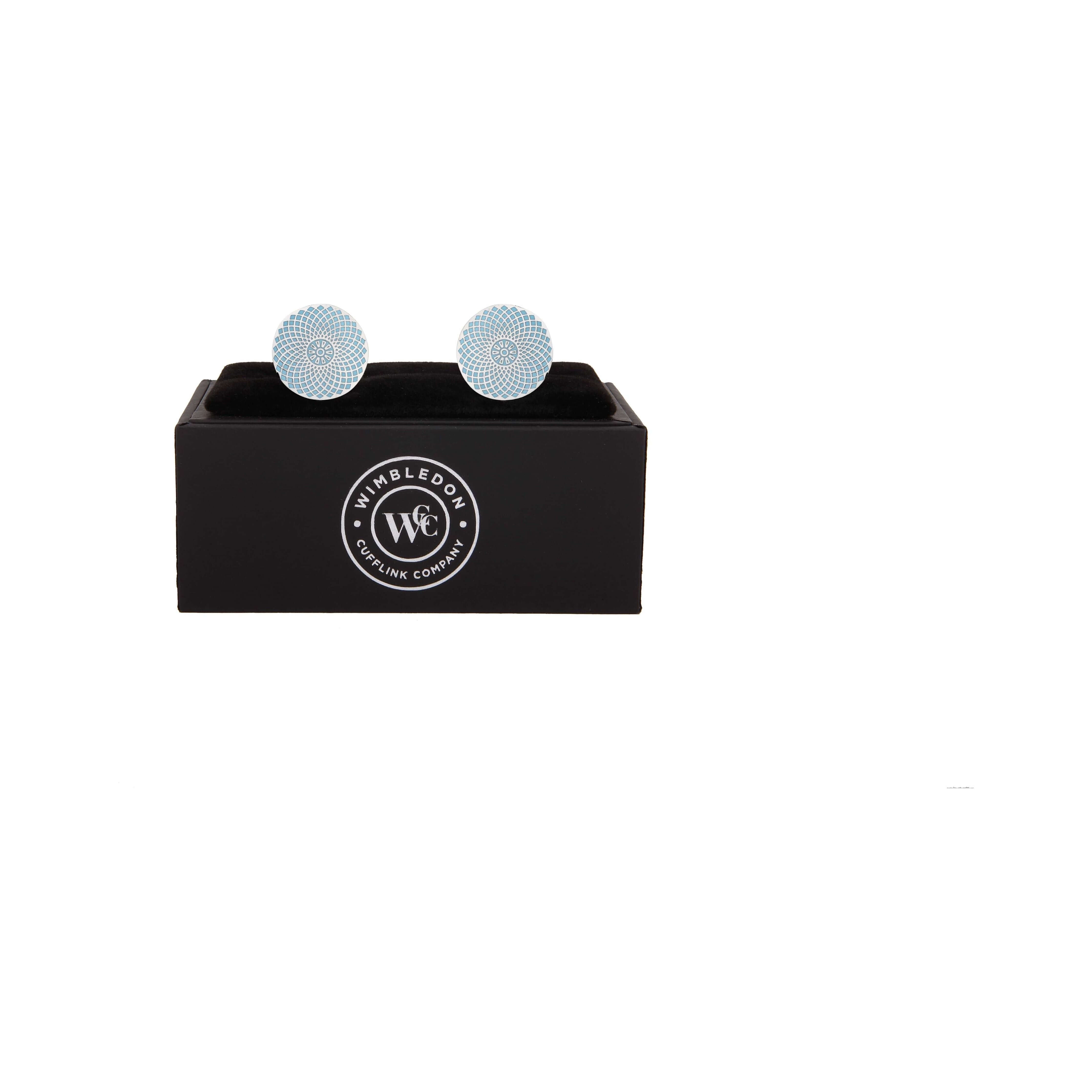 The Gherkin Cufflinks in silver and light blue, inspired by London's landmark, displayed in a black box with logo.