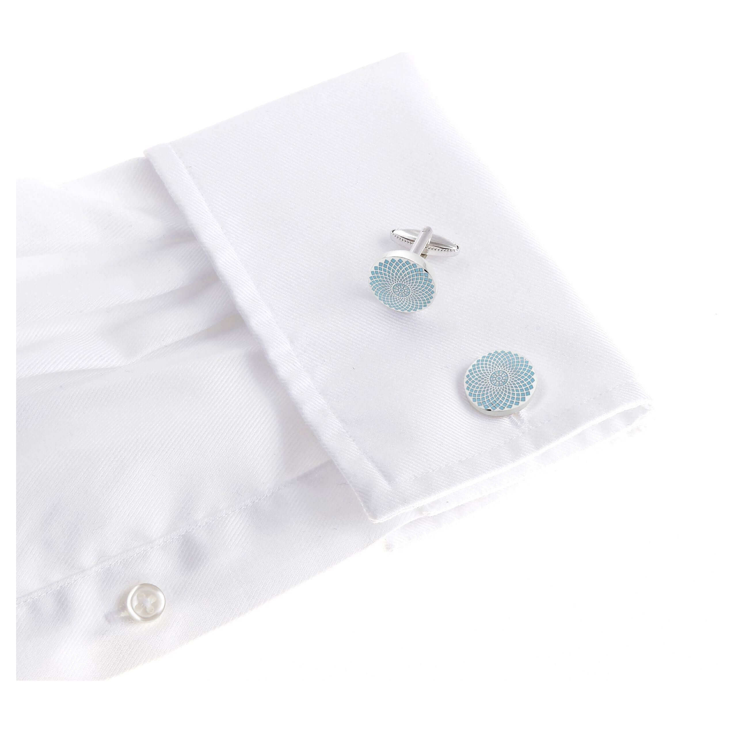 The Gherkin Cufflinks in silver and light blue on a white shirt, inspired by London's architectural marvel.