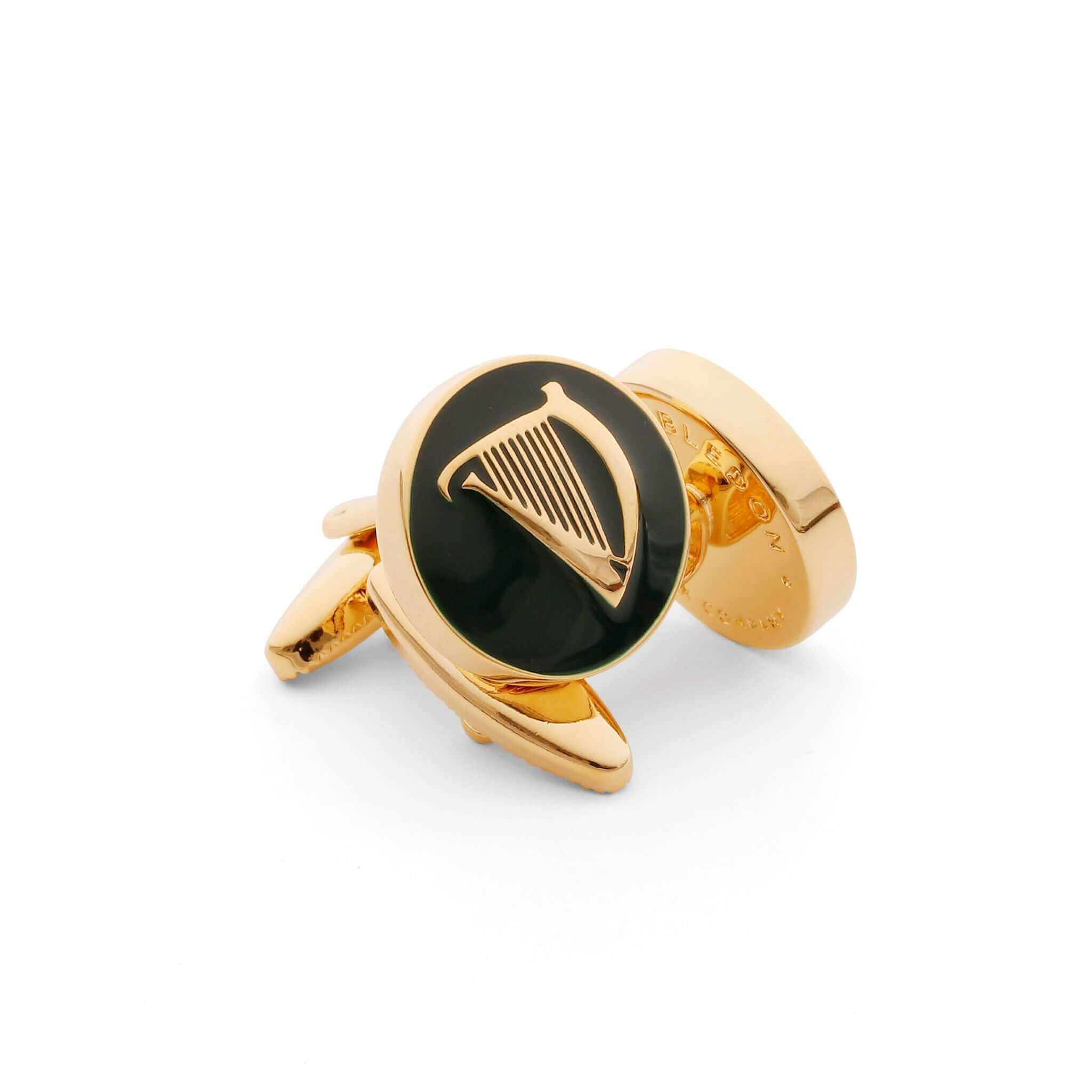 Gold Irish harp cufflinks symbolizing Irish heritage and pride, featuring a detailed harp design on a black background