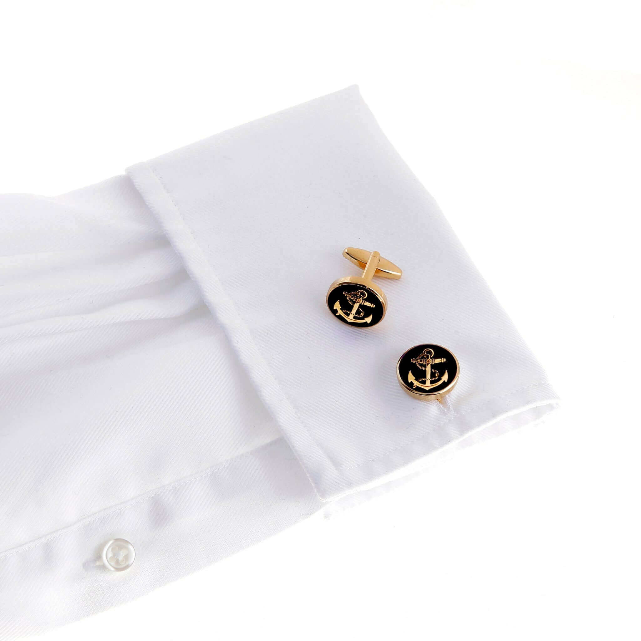 The Ships Anchor Gold Cufflinks II on white dress shirt, representing nautical tradition, safety, and endurance, black and gold design.