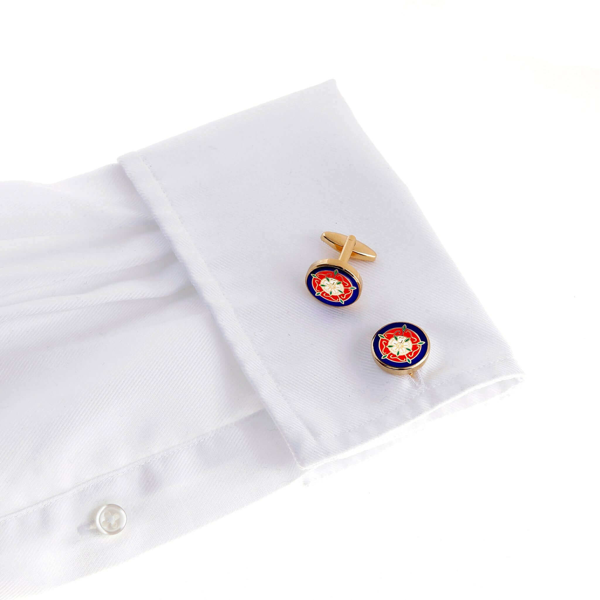 Tudor Rose Gold Cufflink on white dress shirt cuff displaying the red and white emblem of unity and English heritage