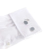 The Rose of Notre Dame silver cufflink featuring a sky blue circular gothic window design on a white dress shirt.