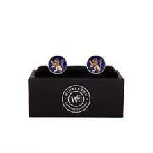 The English Lion Cufflink displaying heraldic lion symbol on blue background, inspired by English royalty, in elegant black box.