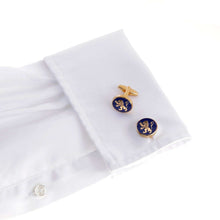 The English Lion Cufflink on a white shirt cuff, featuring a golden lion on hind legs with raised forepaws, symbolizing English royalty and status.