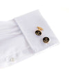 The Ships Anchor Gold Cufflinks II on white dress shirt, representing nautical tradition, safety, and endurance, black and gold design.